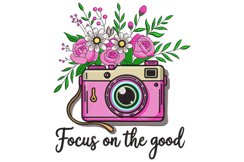 Pink retro camera embroidery design with floral rose and daisy bouquet on top and Focus on the good script underneath