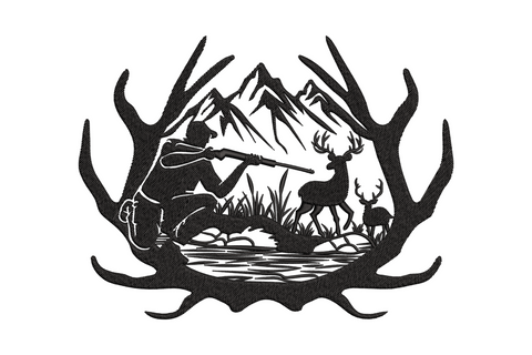 Black embroidery of a kneeling hunter aiming a rifle at 2 deer inside an antler oval frame with mountains and creek behind