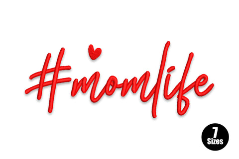 Mom life embroidery design with #momlife in flowing red cursive script and a tiny red heart above the letter i.